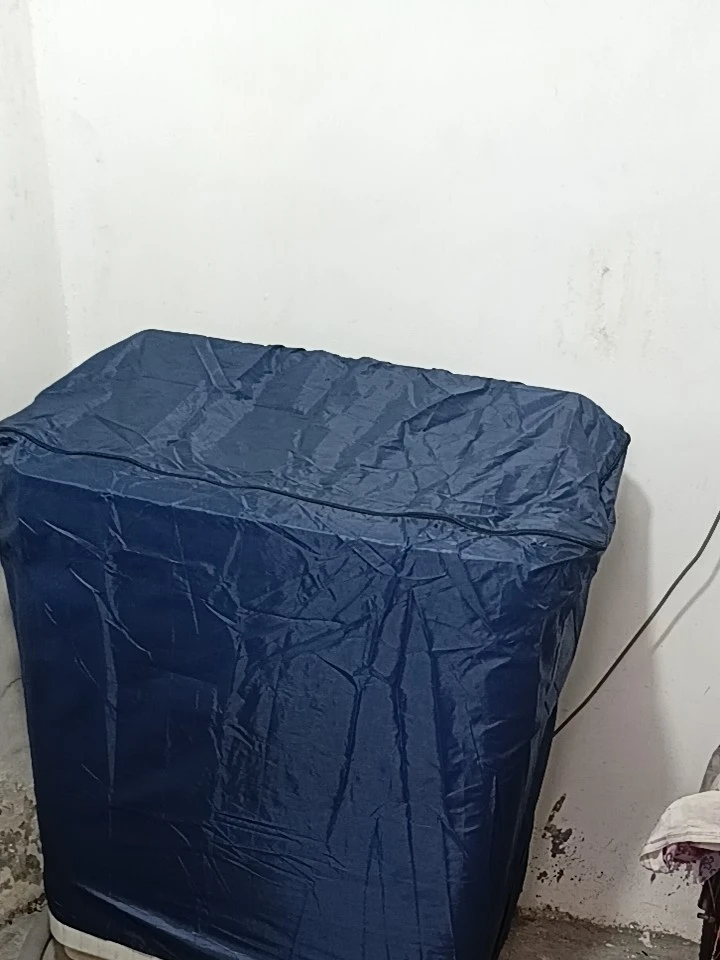 I am extremely satisfied with this navy blue twin tub washing machine cover. The material feels durable, water-resistant, and high-quality, giving full protection against dust, water splashes, and stains. It fits the machine perfectly from top to bottom while keeping the drainage pipe and power cord accessible. The top zipper enclosure makes it very convenient to open and use without having to take the entire cover off every time. Highly recommended for anyone looking to keep their washing machine clean and safe!